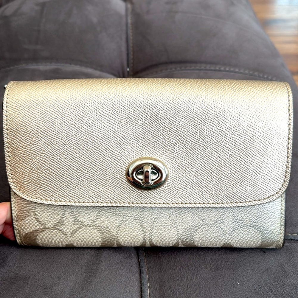 Coach large wristlet. Brand new, no tags. Gold/cream.